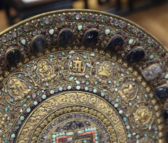 A Tibetan gilt copper and gem set altar dish, 19th century, diameter 40.5cm, small losses